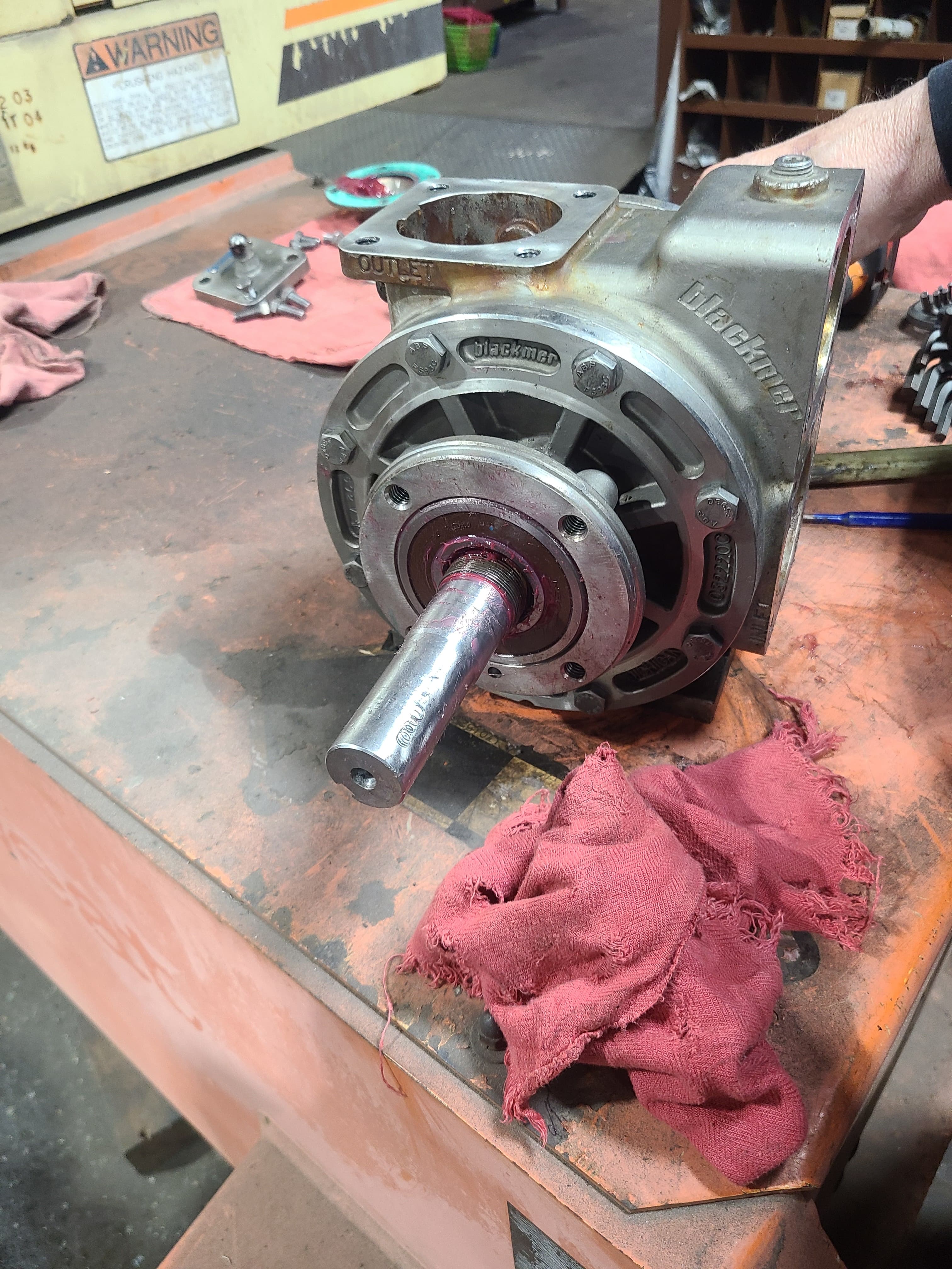 Disassembled Blackmer sliding-vane product pump on the shop bench during a rebuild